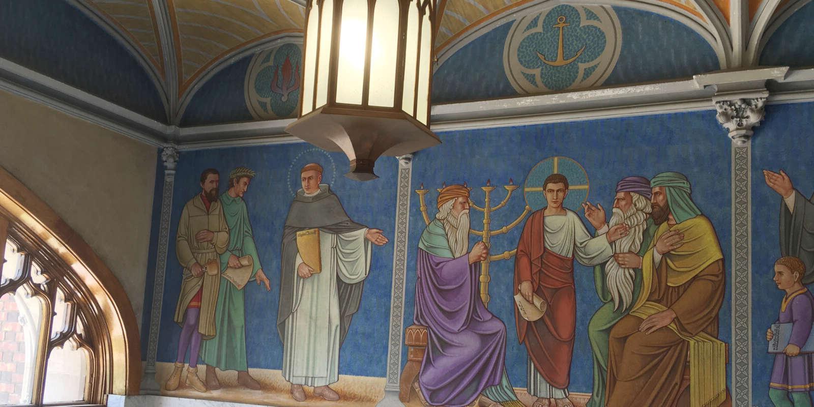 The mural in the entrance of St. Benedict Hall