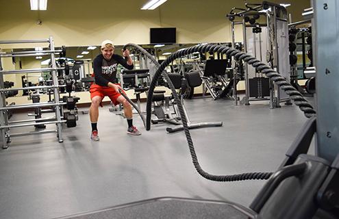 Student exercising with rope